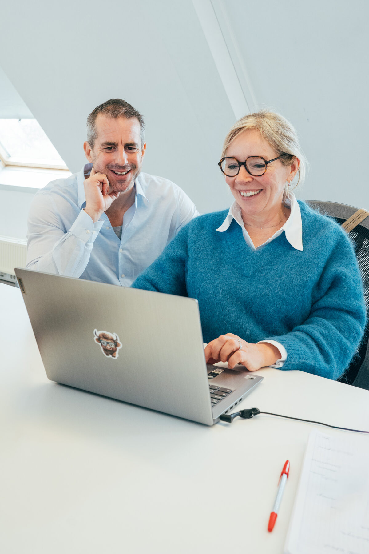 Two Generations consultants reviewing candidates together on a laptop